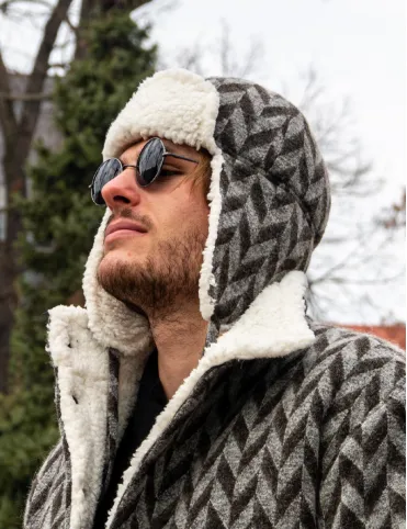 Men's wool hat with earflaps. Made of sheep wool with a geometric pattern.