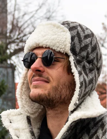 Men's wool hat with earflaps. Made of sheep wool with a geometric pattern.