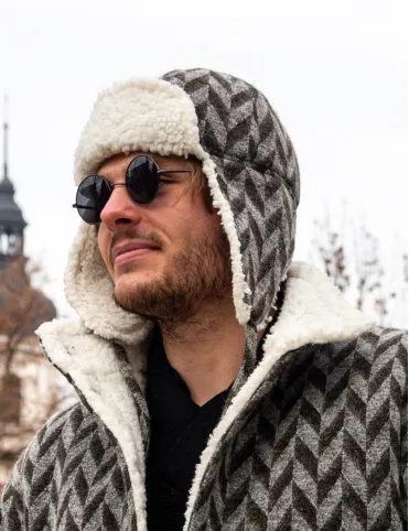 Men's wool hat with earflaps. Made of sheep wool with a geometric pattern.