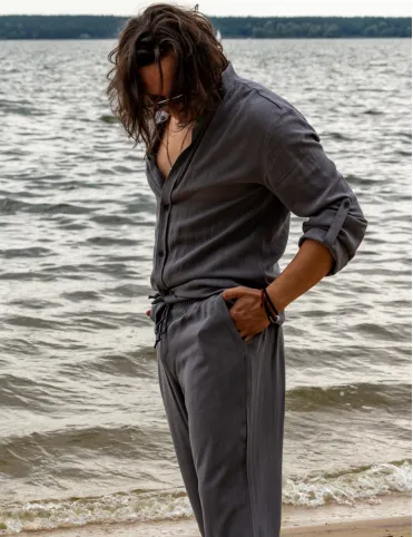 Men's linen trousers are loose in the pockets. BALI