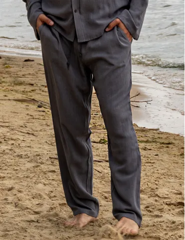 Men's linen trousers are loose in the pockets. BALI