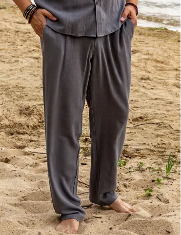 Men's linen trousers are loose in the pockets. BALI