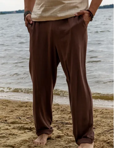 Men's linen trousers with a loose fit and elasticated waistband.