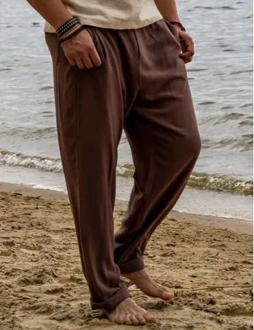 Men's linen trousers with a loose fit and elasticated waistband.