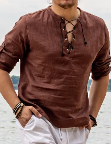 Linen shirt with long sleeves and decorative neckline, with leather lacing